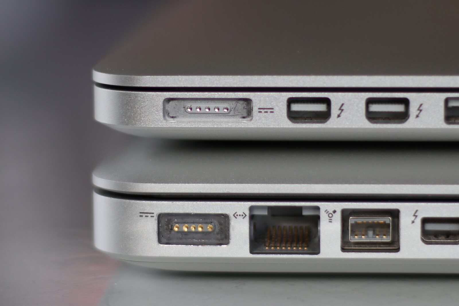 Original MagSafe connector shown above the thinner MagSafe 2 redesign