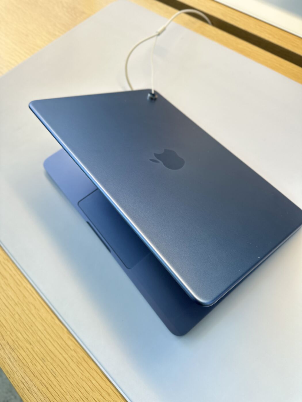 The Indigo finish and recessed Apple logo on the lid