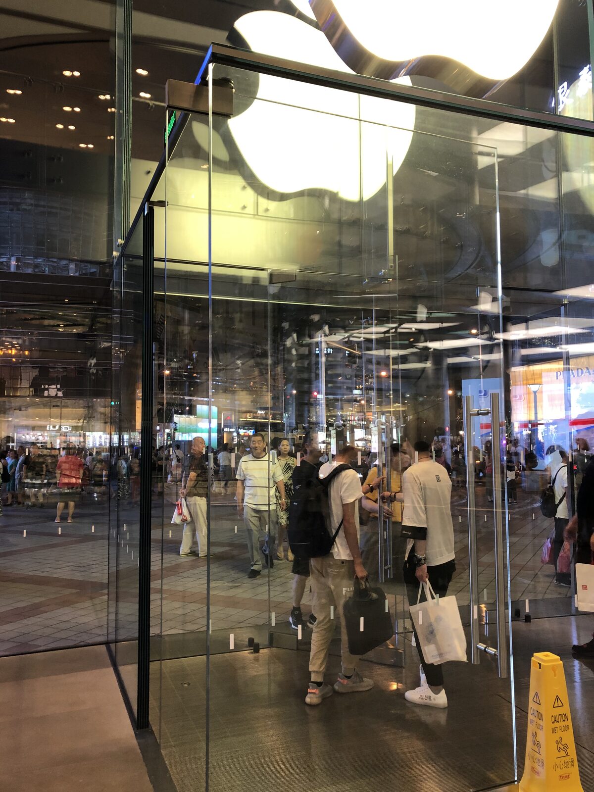 Down through the glass floors to the store below.
