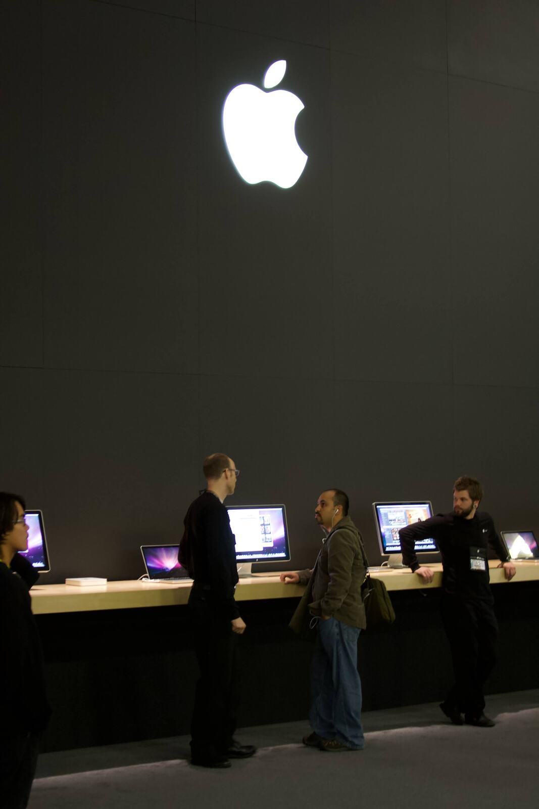 The glowing logo over the MacBook tables inside.