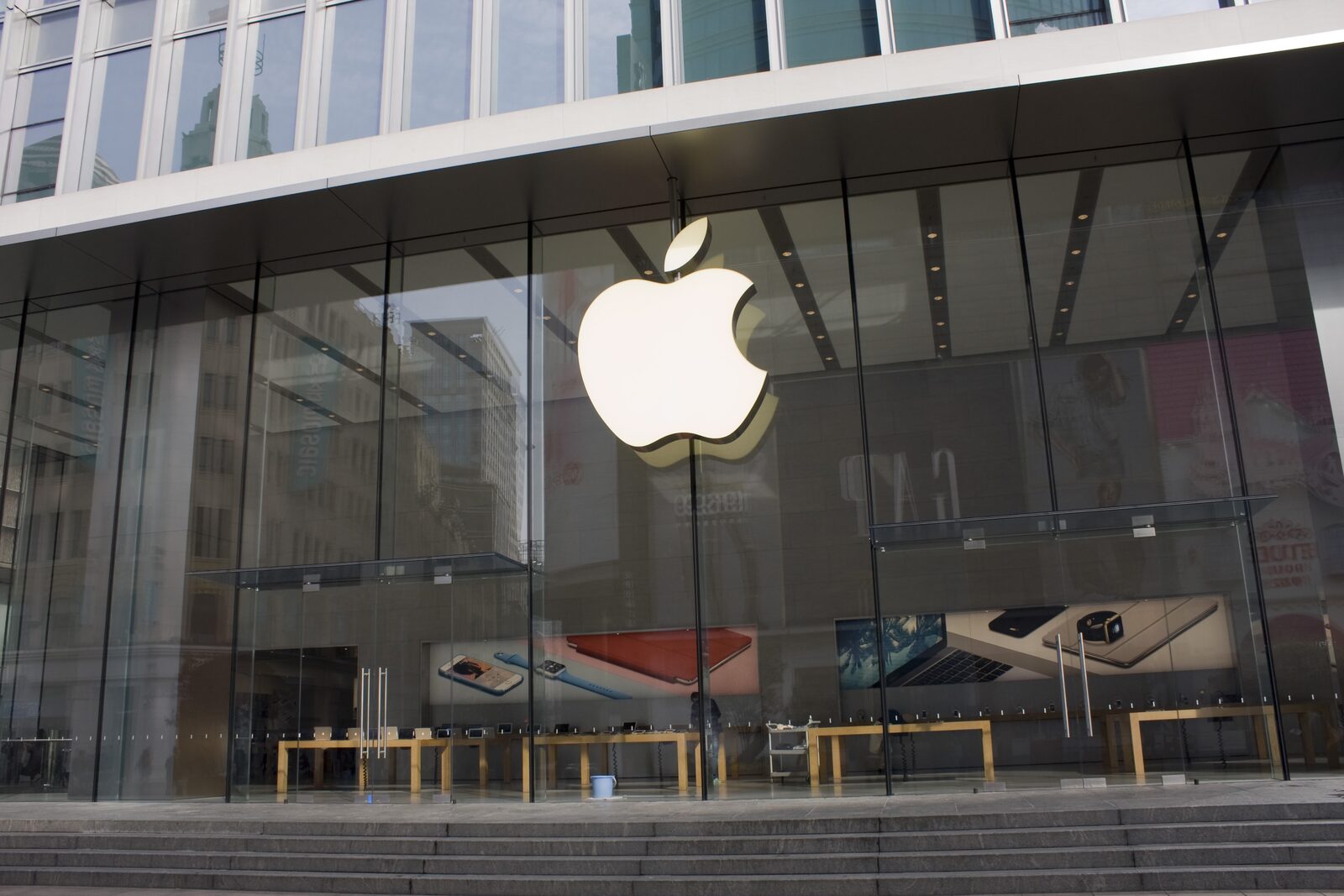 A glass storefront on Nanjing Road, a red iPhone in the window.