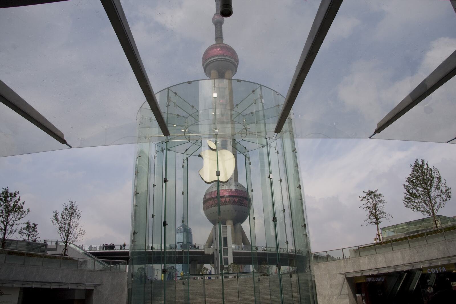 The glass cylinder with the Oriental Pearl Tower reflected across it.