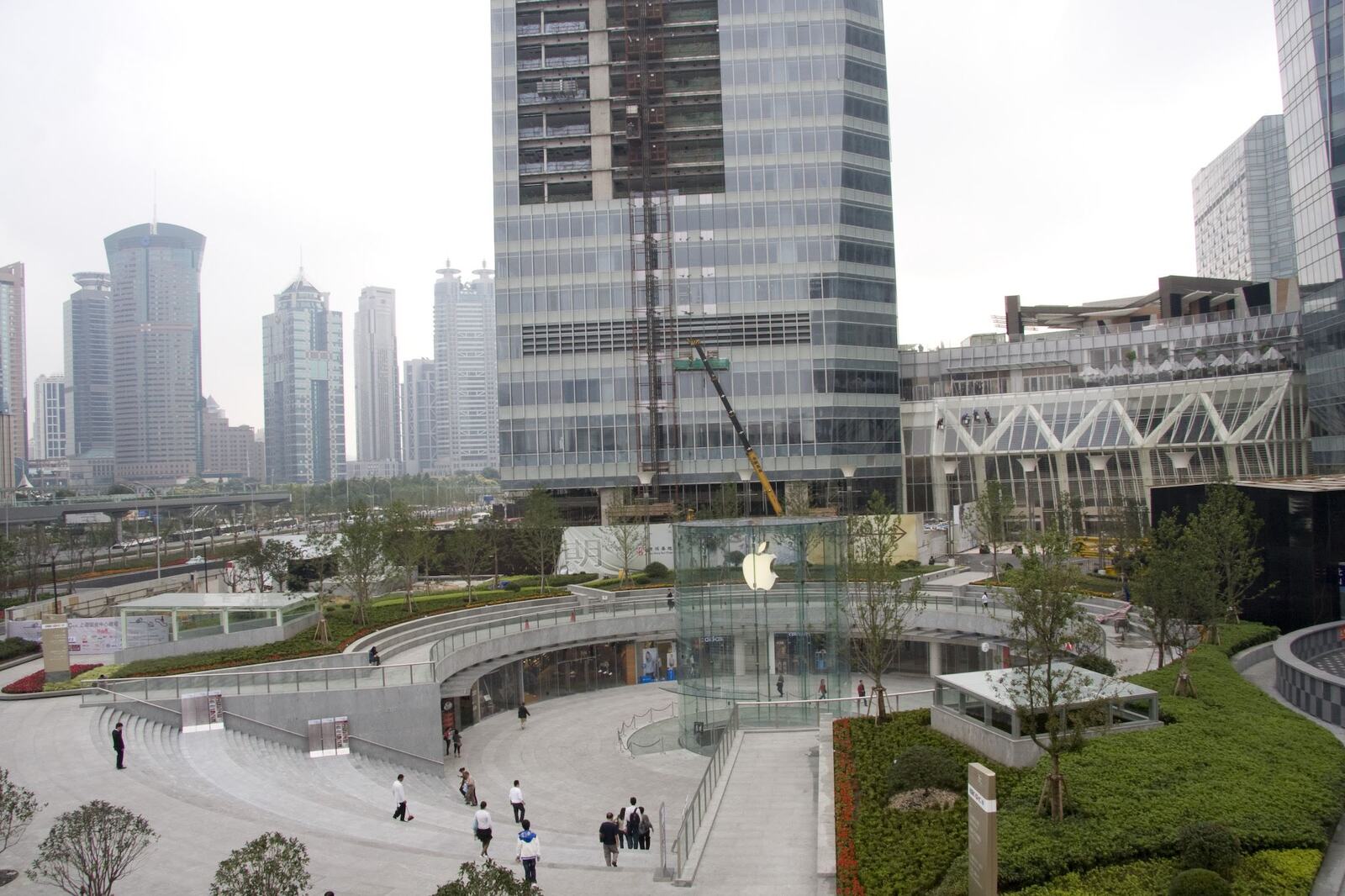 The sunken plaza above the store, Pudong’s skyline behind.